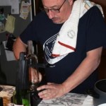 Preparing to cut a clear bottle.