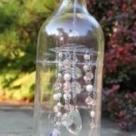 The interior of the bottle is complete - the pixie is in place, the chains are hanging and the top's closed with a wooden disc and door knob.